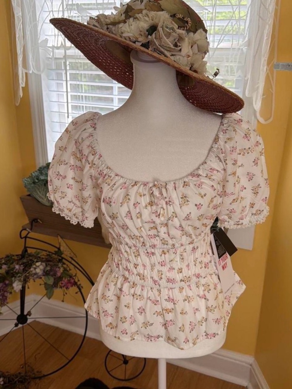 Women’s size medium new with tags pink floral babydoll peasant top.